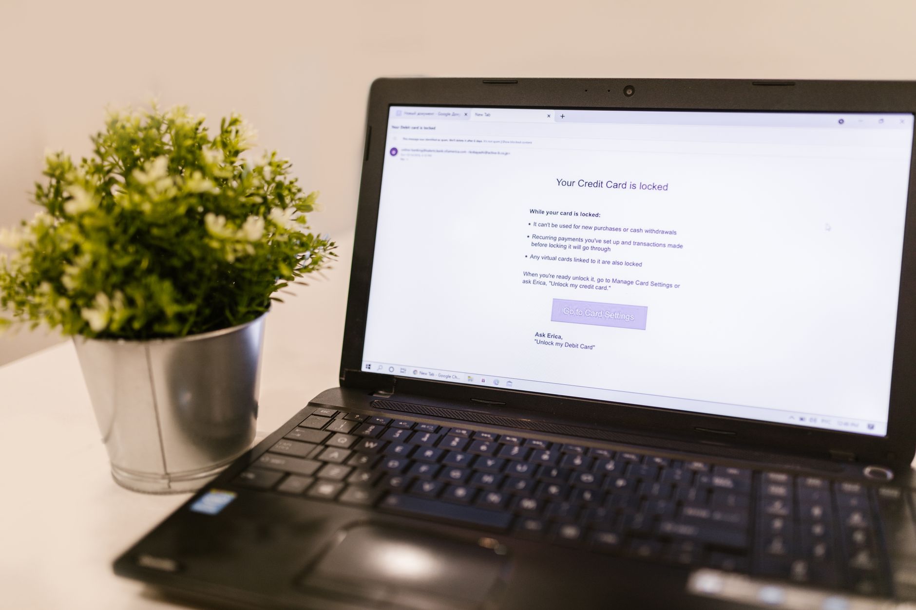 A person viewing a credit report and identity protection dashboard on a laptop screen